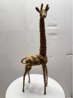 Origin and Design: This style and technique—involving rope woven over a flexible wire frame—are traditionally attributed to the Danish design duo Kay 