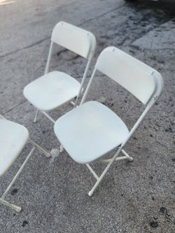 Used white folding chairs s,a,l, e