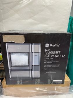 Ice maker with side tank