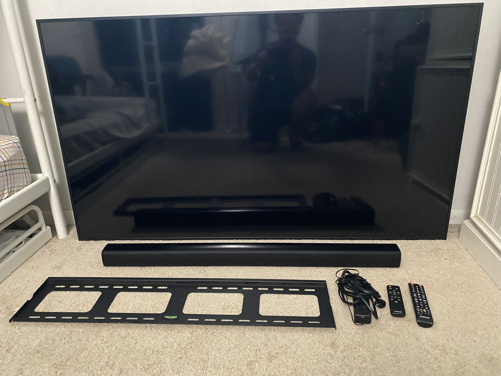Samsung 65 4k TV with a Sound Bar and Wall Mounts Hardware Included