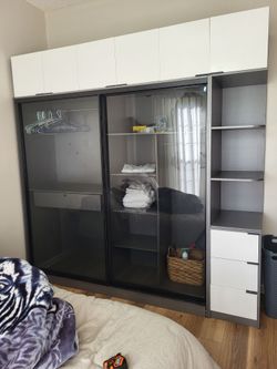 Wardrobe closet with glass siding doors
