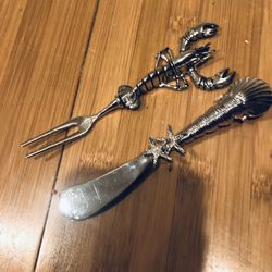 Adorable Pair of Appetizer Fork And Spreader in a Seaside Theme. One with a Lobster and one with Starfish And Shells