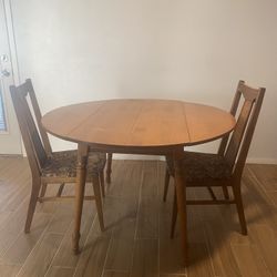 Solid Wood Drop-Leaf Dining Table + 2 Chairs – Classic vintage set in a warm wood tone. Table is versatile: use it round/expanded for more seating or 