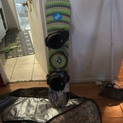 a Nitro Ripper x Volcom kids' snowboard. 121.with a dakine bag 