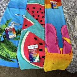 New beach towels, three for $20