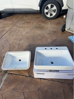 2 sinks, One Kohler and One off brand.