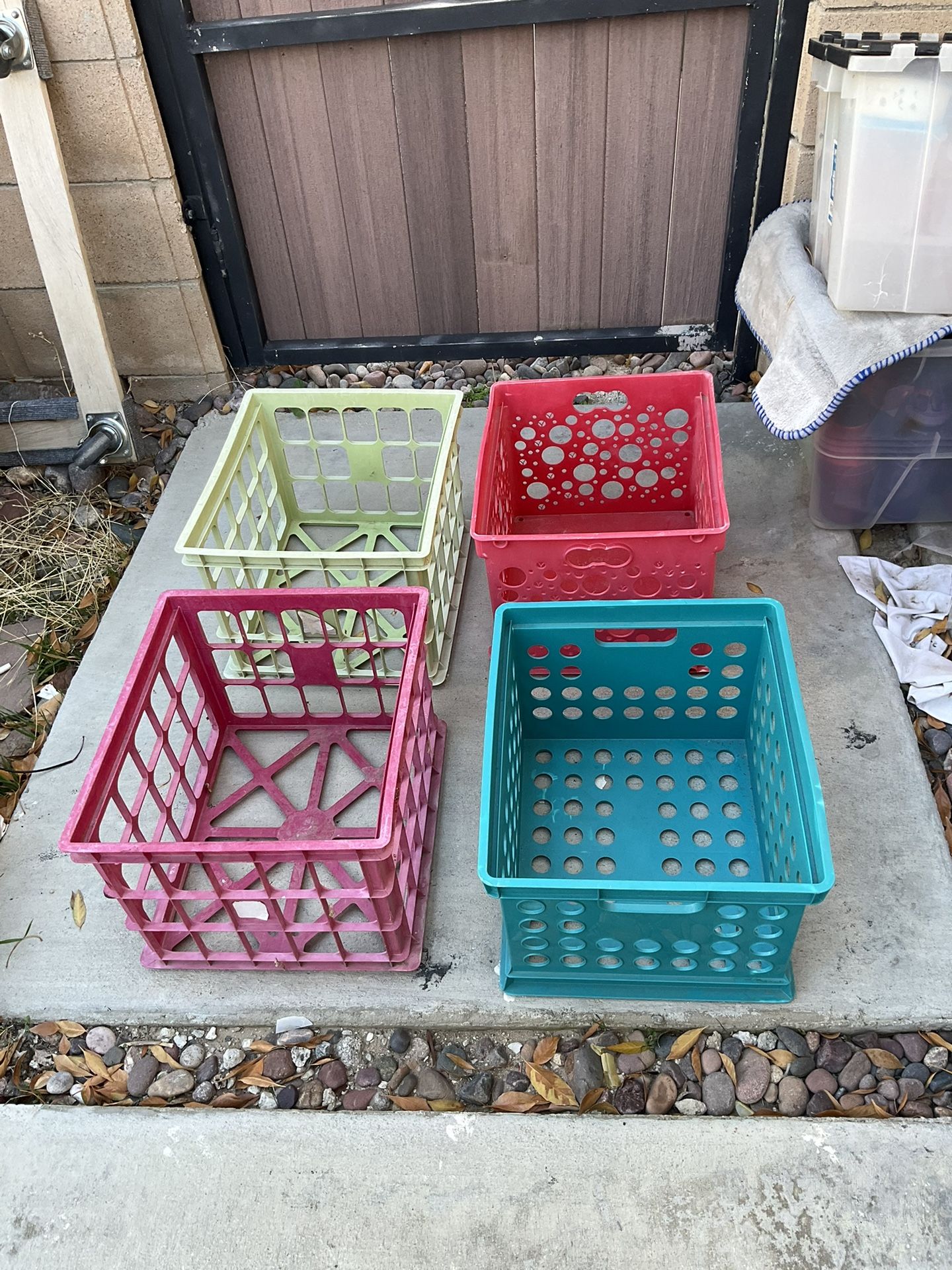 Four storage plastic baskets 15.75”x13,75”x11” $6 each