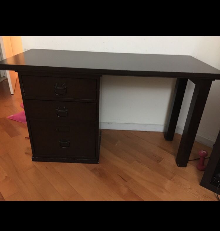Wooden desk with three drawers