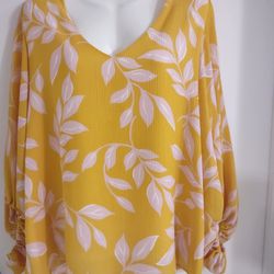 Tyche Sleeve blouse with elastic on the sleeves, yellow color with white leaves, double lining, 100% polyester, size L, the blouse was worn only once.