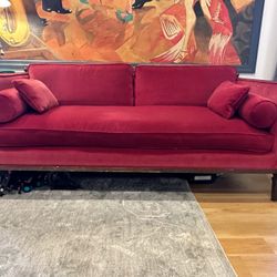 Red Velvet Couch With Six Legs 