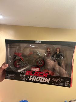Black widow figure and box signed by box artist Ken lashley