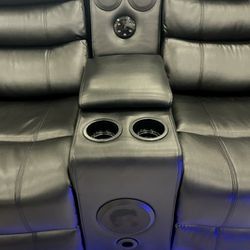 New leather reclining sectional with speakers
