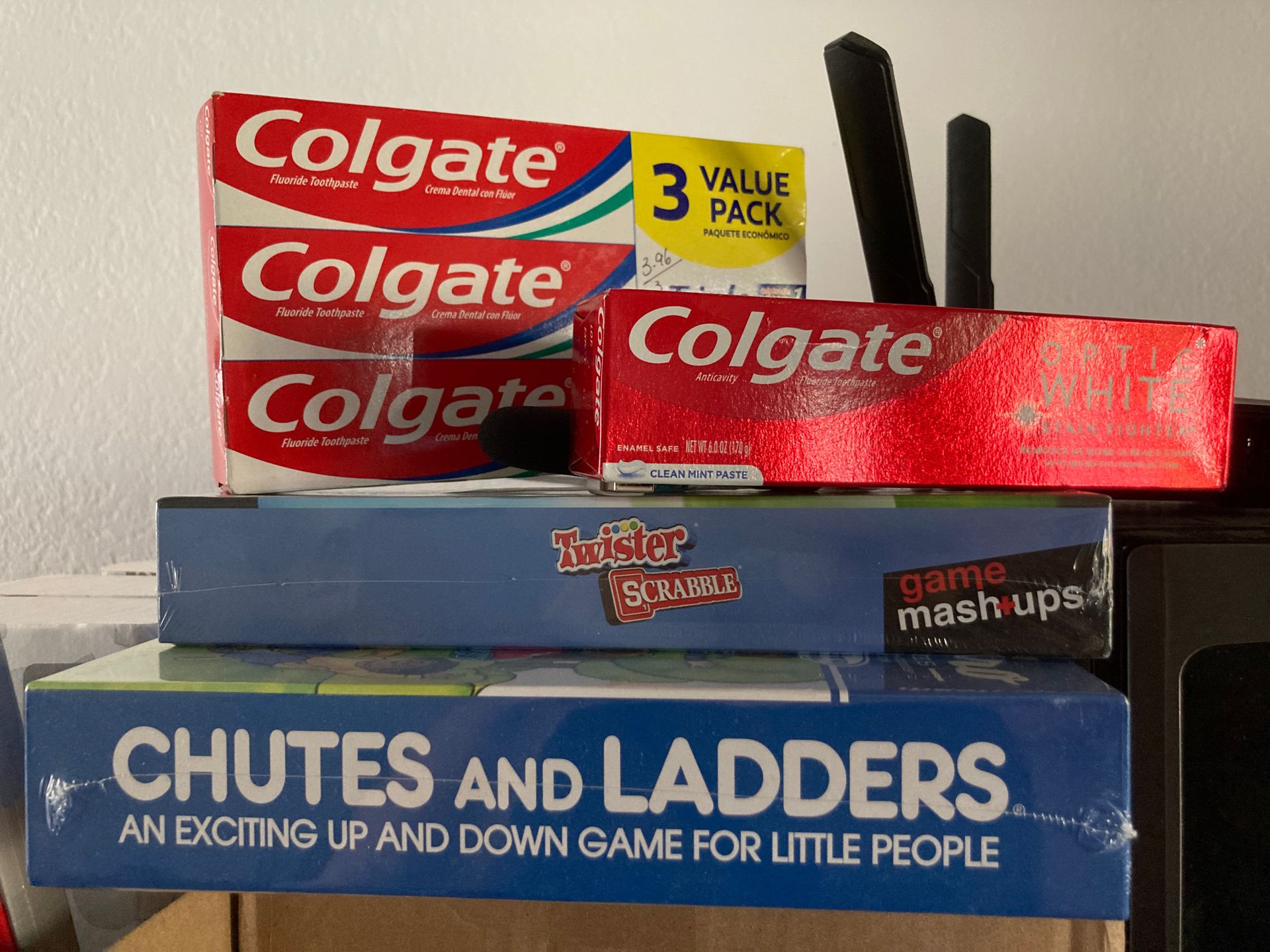 Chutes and ladders retro board game + twister x scrabble board game + Colgate toothpaste