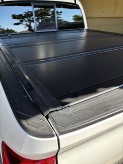 Truck bed cover fits a 2023 Toyota Tacoma double cab 5ft short bed