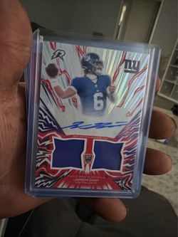 Jaxson Dart Topps RC Auto Dual Relic Card