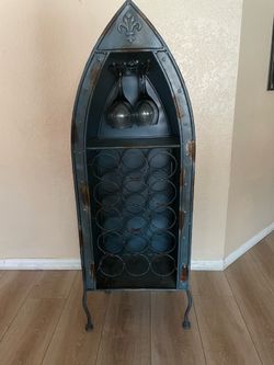 Tall metal boat wine holder