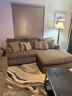 Gray couches with tan under tone