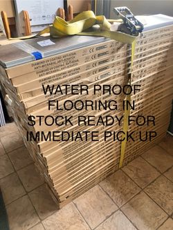 8MM 100% WATERPROOF SPC RIGID CORE FLOORING WITH ATTACHED ACOUSTIC ANTIMICROBIAL PAD .DESIGNER 9”x60” PLANK. COMMERCIAL  26 MIL WEAR LAYER! KID PROOF