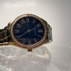 Kenneth Cole gold watch men  The battery works