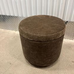 Gray cloth foot stool … in good condition. Swivels and With storage space inside .  18 “ round x 17 “ high … $40
