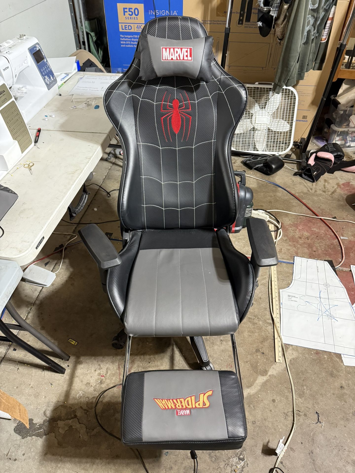 Spider-man gaming chair with extended leg rest, massage head attachment