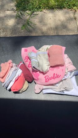 A bib, socks, hats and mittens