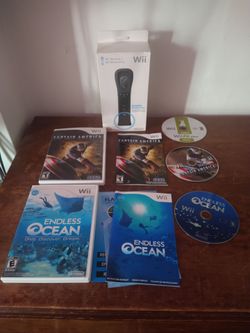 Black Wii controller (factory sealed) w/3 games