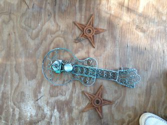Cast iron stars and guitar outside decor