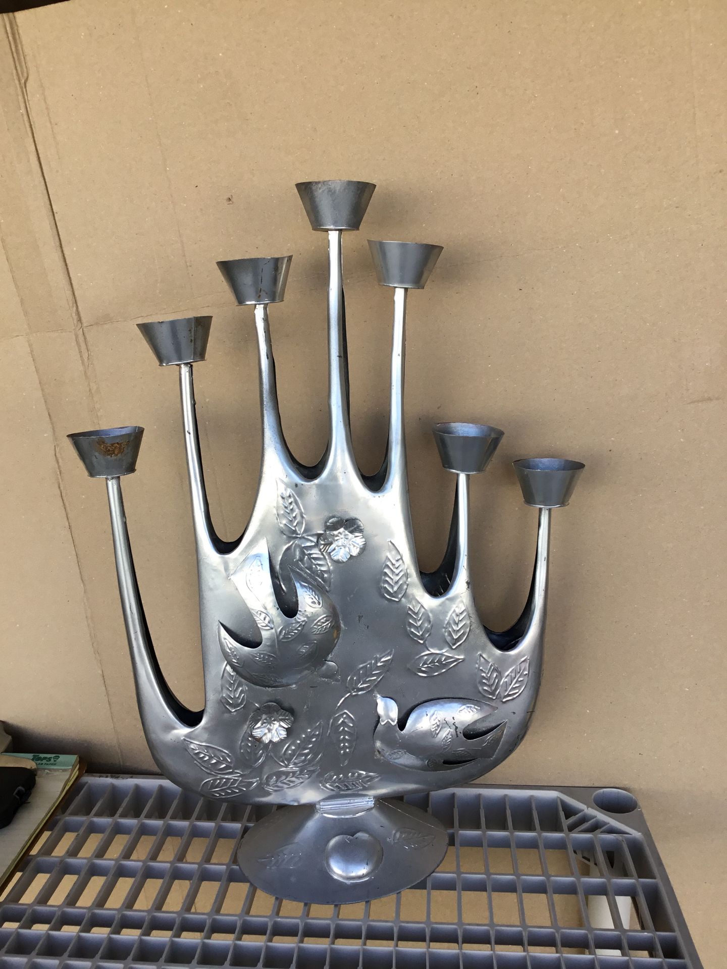 Hammered tin candelabra, a collectible Mexican folk art piece dating from the 1960