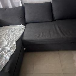 IKEA gray couch with pull out bed and storage