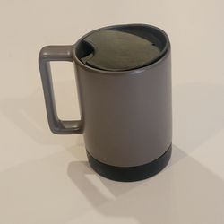 Starbucks 14oz ceramic travel mug gunmetal gray color black rubber 
non-skid base. Pre-owned, very good shape, please see the photos. It is 
5" tall, 