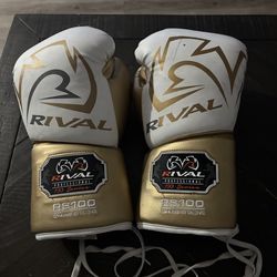 White and gold Rival RS100 boxing gloves