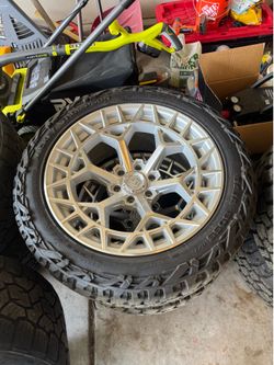 Selling a complete set of 4 TIS wheels with Maxxis RAZR MT tires.