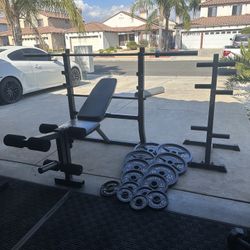 Bench press with 255lbs of Olympic weights plus 7ft bar with weights tree