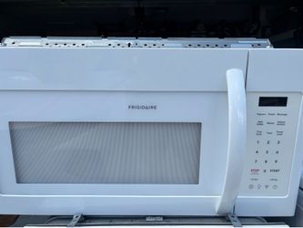 Mounted over the range microwave. Works great. Clean