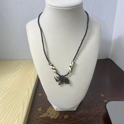 Hand Carved Rhino Pendant  With Black Beaded Chain And Two Large Cylindrical Beads With A Batik-like Pattern African 