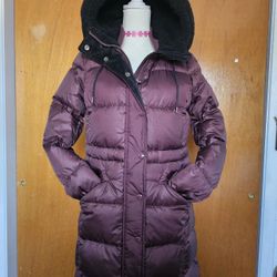 Plum colored coach puffer jacket.