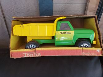 Vintage yellow and green Tonka dump truck