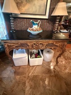 Ornate bronze riding desk with black marble top