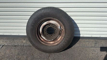One 8 Lug 16 Inch Steel Wheel And Old Tire Fits Classic Ford, Dodge, And Chevy