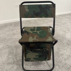 Brand-new foldable camping stool with a built-in insulated cooler bag. • Sturdy black metal frame with comfortable fabric seat and backrest • Camoufla