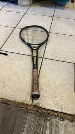 Black Tennis Racket With Brown Leather Handle