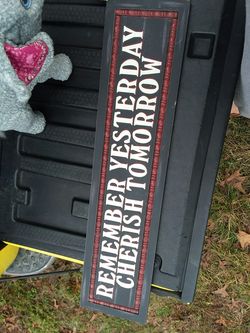 Sign saying remember yesterday cherish tomorrow