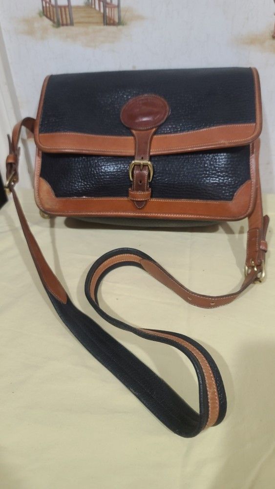 VINTAGE DOONEY AND BOURKE BLACK ALL WEATHER LEATHER AND BROWN LEATHER TRIM BAG