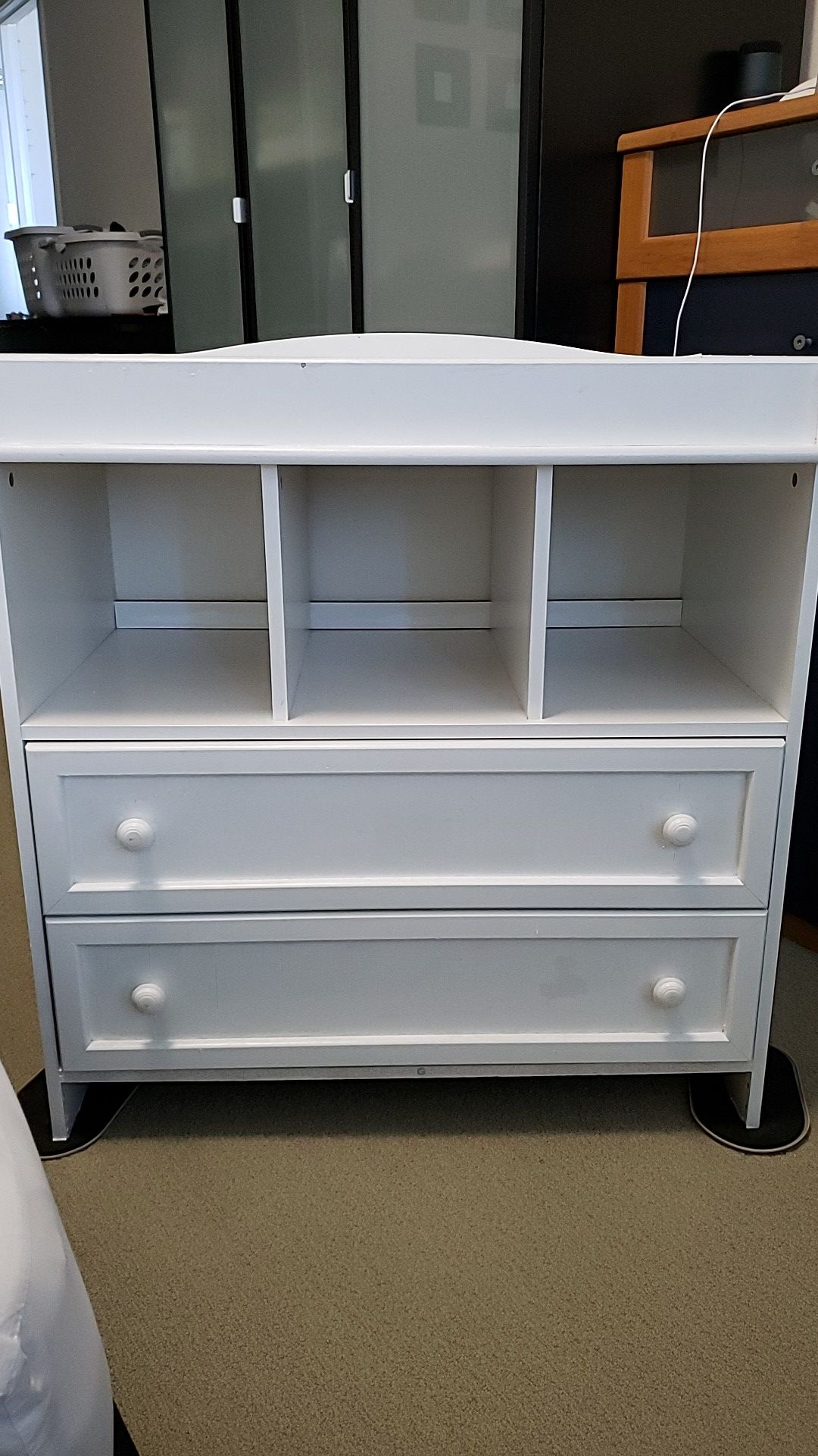 White wooden changing table with drawers