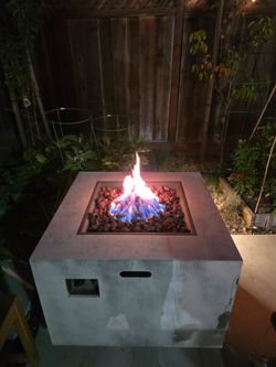 Propane fire pit with tank included and lava rocks included