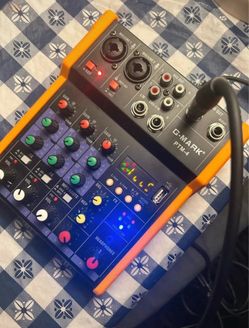 G-MARK PTM-4, a compact 4-channel analog audio mixer.