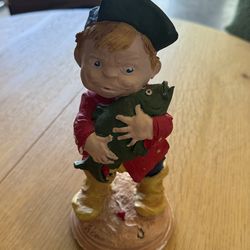 Boy Holding Fish Sculpture