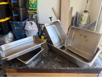Five stainless steel pans