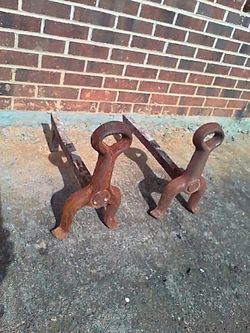 Cast iron fire-dogs